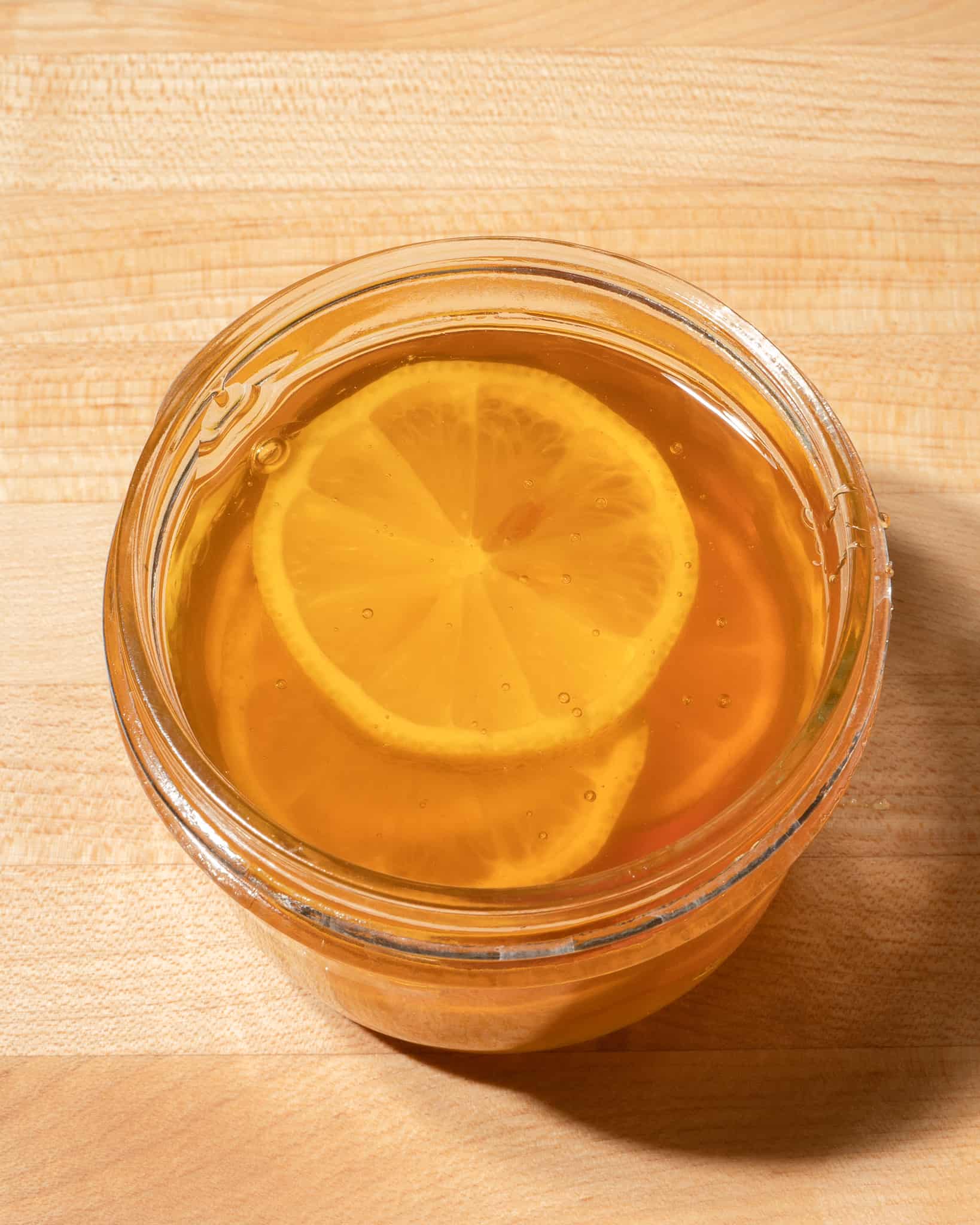 honey & lemon slices in a mason jar