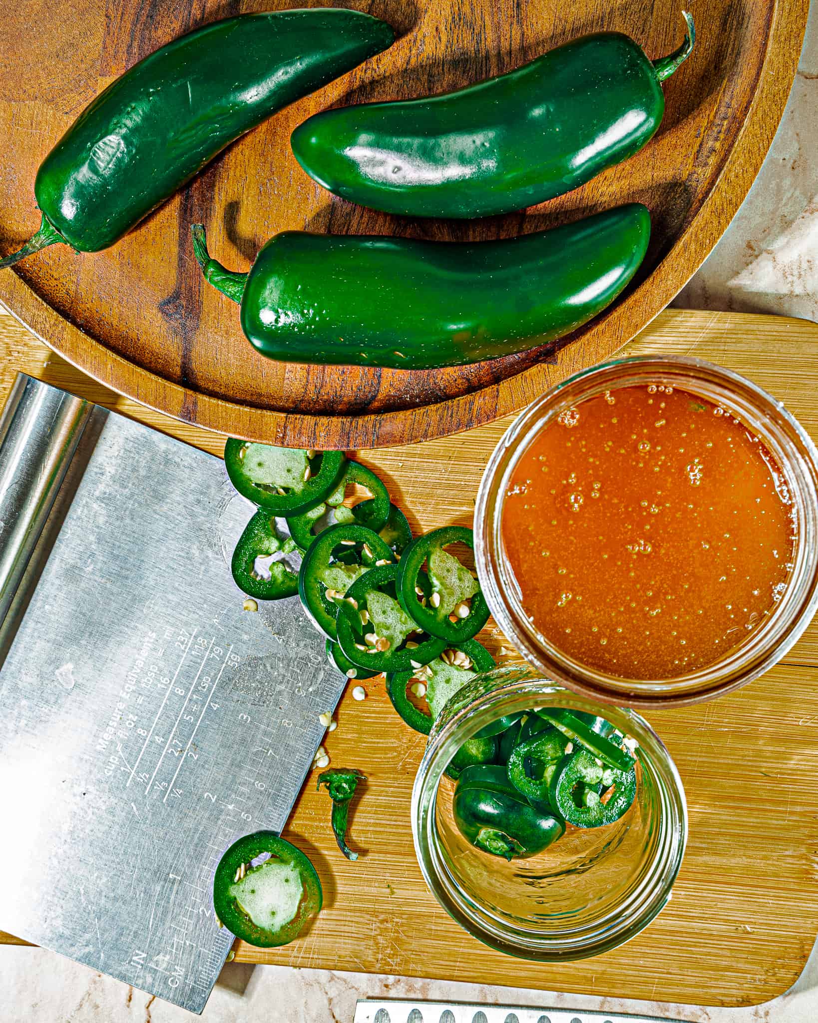 jalapeno peppers whole and sliced with jar of raw honey