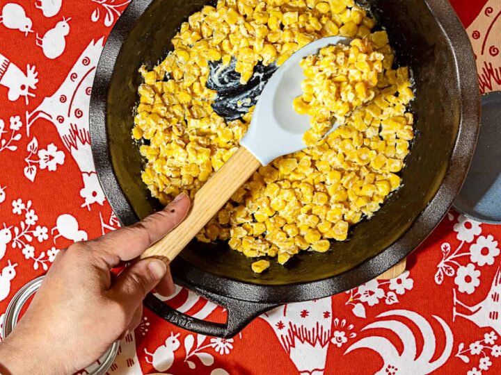 rubber spatula in creamy corn side dish