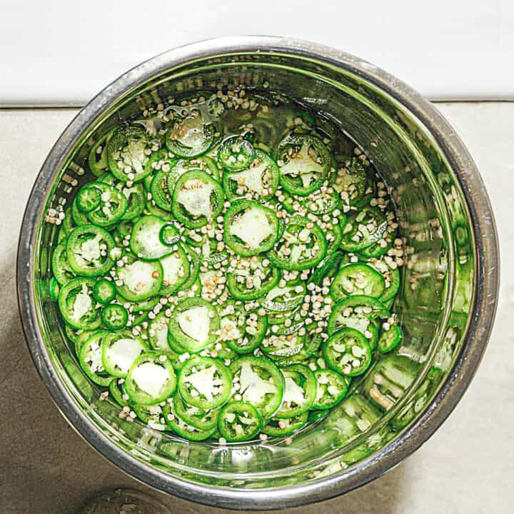 metal bowl with green jalapeno simple syrup