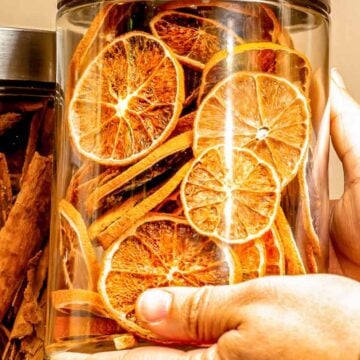 person holding dried orange slices