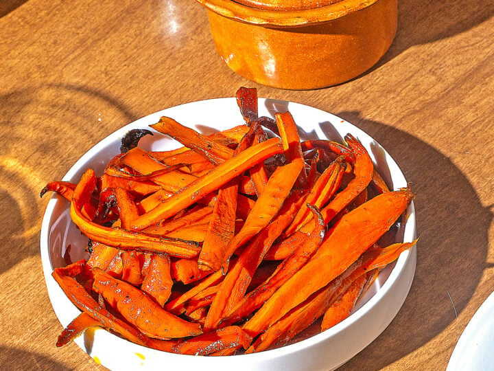 honey roasted carrots on a white round plate
