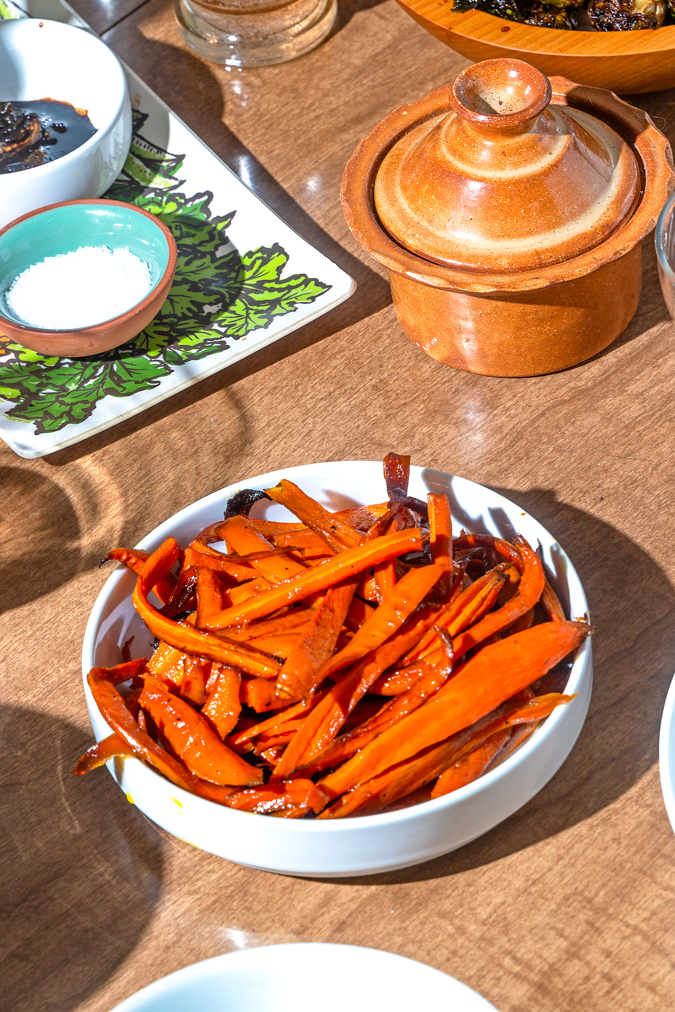 roasted carrots on a white round plate